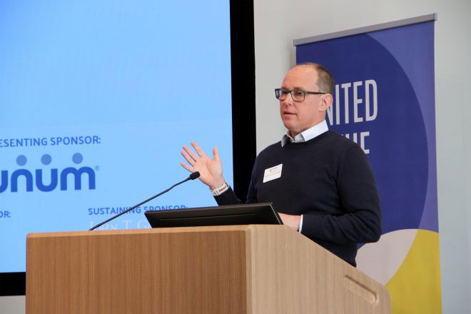 Dan Coyne speaking at a podium